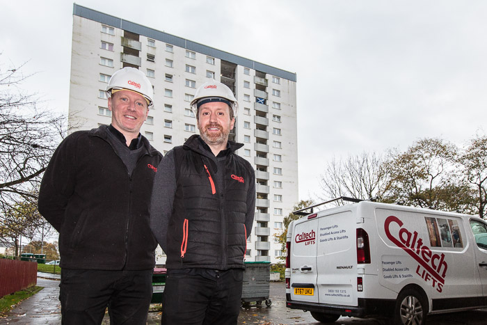 Fraser (left) and Andrew Renwick on-site with the Tulloch Court flats behind.